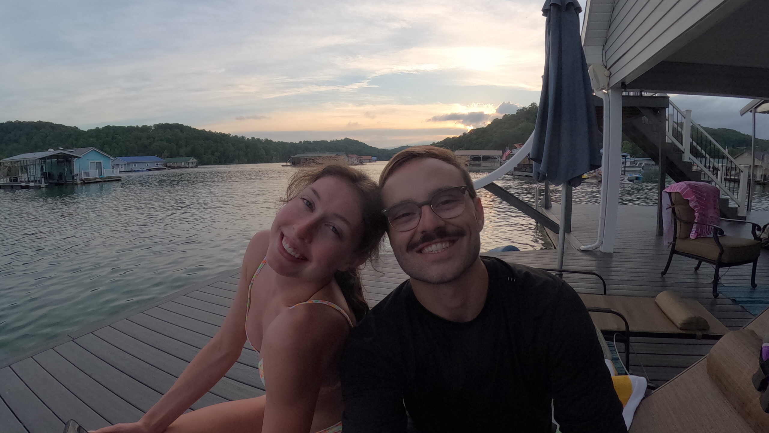 Peyto & Sopho smiling at Grey Goose Floating House on Lake Norris, Tennessee.